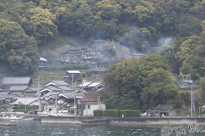 Japan_20080415_174400_000_2X.jpg - Morning mist rises from a Buddhist cemetery; cremation is the rule in Japan and the monuments are more to recognize the dead than to mark a burial spot.  Uwajima Japan.