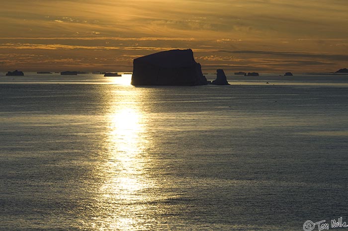 ArcticQ_20080829_195552_476_2X.jpg - A bright beam from the setting sun reflects on the icy waters off Cape York, Nunavut, Canada.