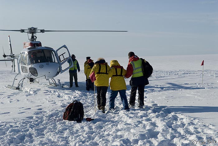 ArcticQ_20080830_161436_152_20.jpg - Linda and an expedition staffer help a Japanese lady navigate the snow on the ice cap near Qaanaaq Greenland.