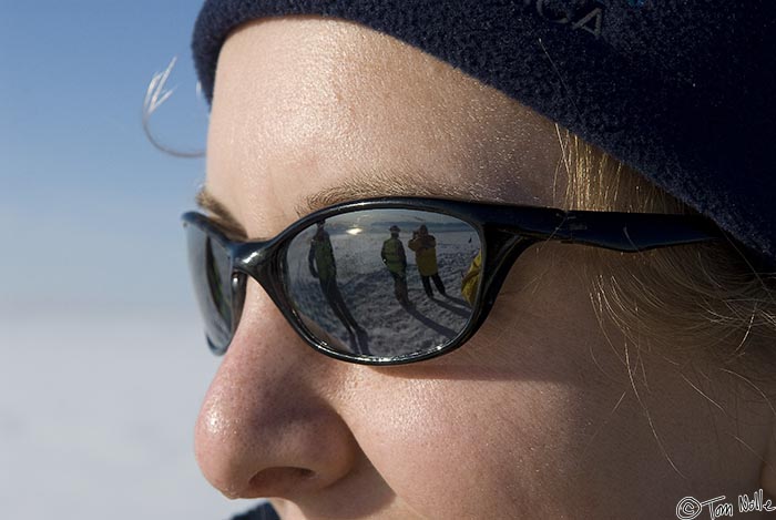 ArcticQ_20080830_161808_171_20.jpg - Passengers are reflected in the sunglasses of the ship's photographers.  The ice cap near Qaanaaq Greenland.