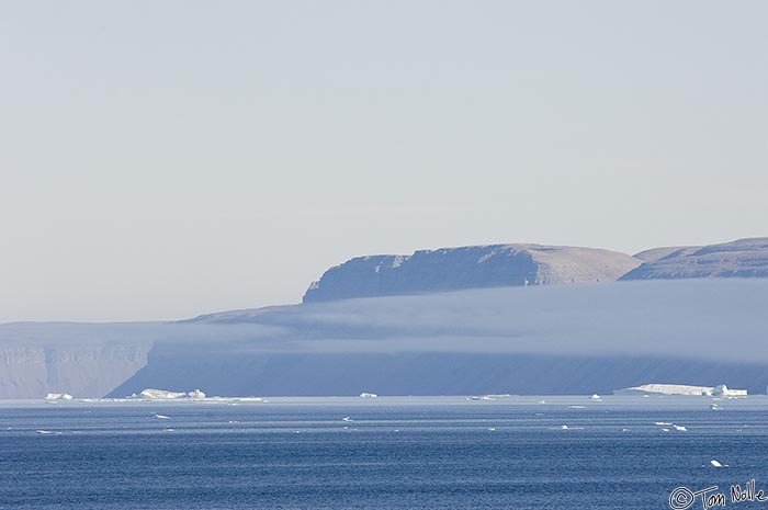 ArcticQ_20080831_135652_359_2X.jpg - A small cloud of sea fog hovers above the water near the coast of Greenland.