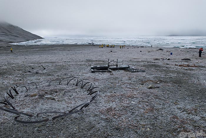 ArcticQ_20080901_100654_323_20.jpg - Relics of early expeditions are in the foreground of the landing area for our helicopter.  Fort Conger, Ellesmere Island, Canada.