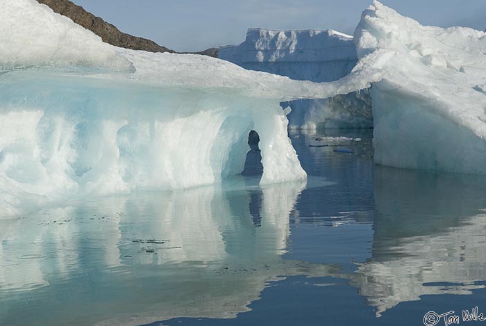 ArcticQ_20080903_105430_019_20.jpg - Large tidal range combines with stranded icebergs to create surreal ice sculptures.  Skraeling Island, Nunavut, Canada.