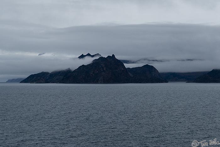 ArcticQ_20080905_115324_190_20.jpg - Low clouds and sea fog obscure a lot of the northern coast of Baffin Island, Nunavut, Canada.