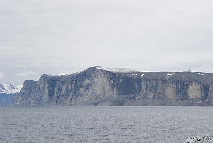 ArcticQ_20080906_082224_205_20.jpg - Steep cliffs like this one at the mouth of Sam Ford Fjord were cut by glaciers in a previous ice age.  Baffin Island, Nunavut, Canada.