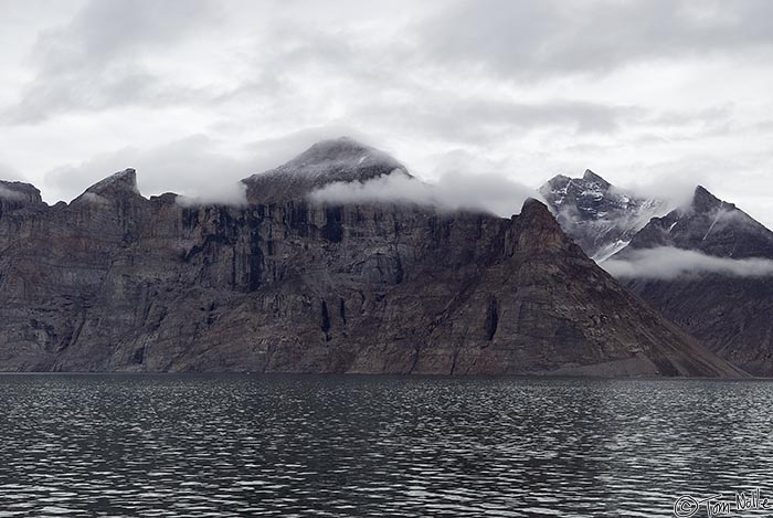 ArcticQ_20080906_113240_550_20.jpg - As we return from our helicopter trip we see clouds are thickening around Sam Ford Fjord.  Baffin Island, Nunavut, Canada.