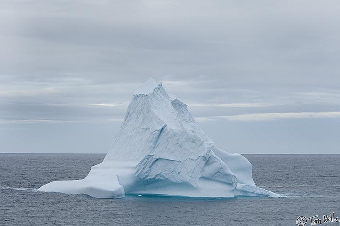 ArcticQ_20080907_153702_107_2X.jpg - An iceberg floats along in Baffin Bay between Greenland and Ellesmere Island on one of the Arctic's not-unusual cloudy days.