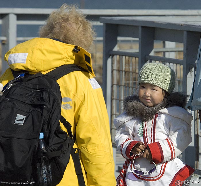 ArcticQ_20080908_121254_266_2X.jpg - Linda gets a tentative smile from the little Inuit girl.  Pangnitung, Baffin Island, Canada.