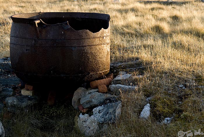 ArcticQ_20080908_180750_734_20.jpg - An old iron kettle likely used for rendering oil from blubber.  Kekerten, Baffin Island, Canada.