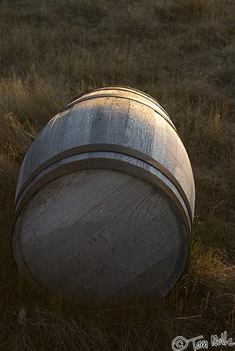 ArcticQ_20080908_183810_767_20.jpg - A barrel once used for provisions now rests in the grass, abandoned.  Kekerten, Baffin Island, Canada.