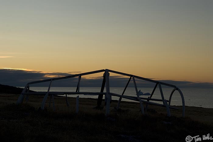 ArcticQ_20080908_185646_787_20.jpg - The frame of a hide or canvas boat stands out against the setting sun in Kekerten, Baffin Island, Canada.